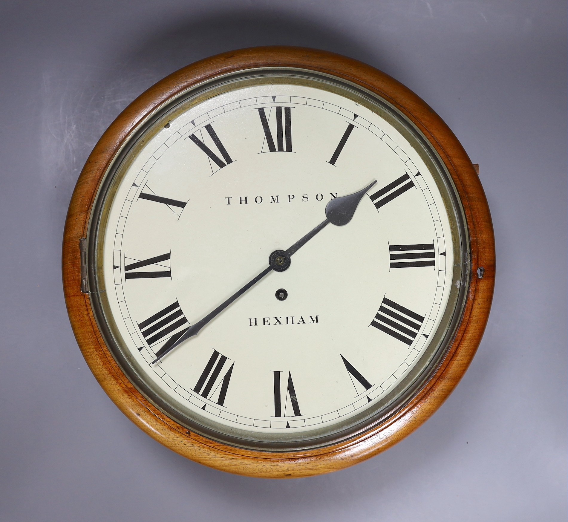 A Victorian mahogany cased eight day circular dial wall timepiece by John Thompson of Hexham, 38cm diameter